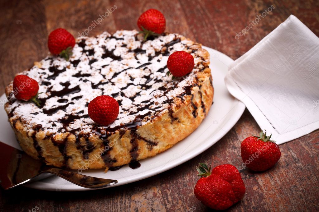 Cheesecake With Chocolate Decorated With Strawberries