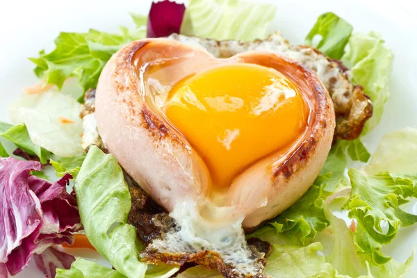 stock image Scrambled eggs with sausage in a heart