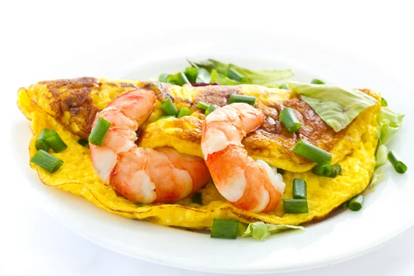 stock image Omelet with cooked shrimp and greens