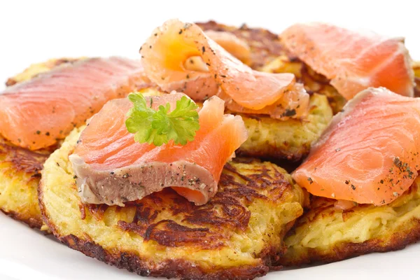 Fried potato pancakes with salted salmon — Stock Photo, Image