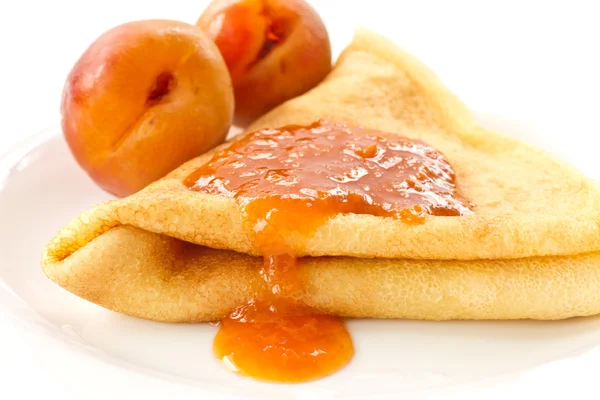 Pancakes with apricot jam — Stock Photo, Image