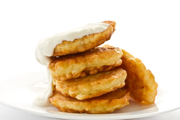 Fried fritters on a white plate — Stock Photo, Image