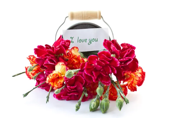 Bright bouquet of carnations in a bucket — Stock Photo, Image