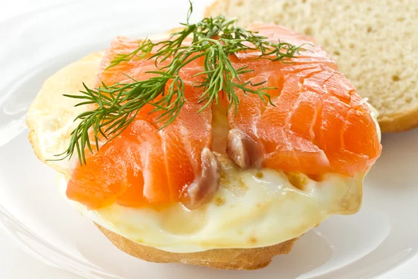 Sandwich with egg and salted salmon — Stock Photo, Image