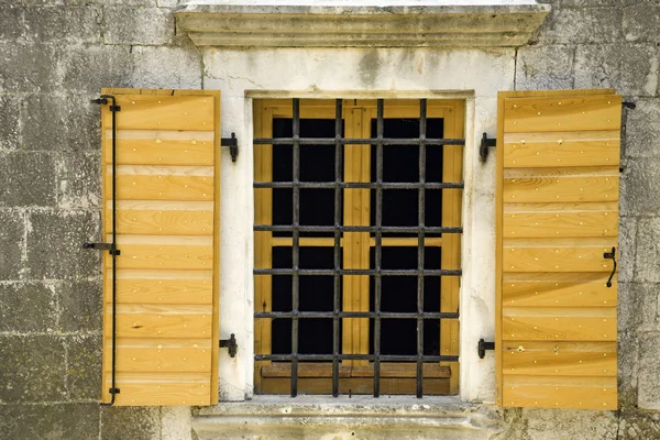 Window with shutters and grid — Stock Photo, Image