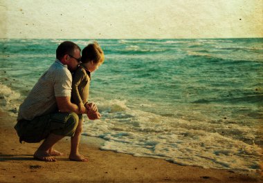 Child with his father at sea clipart