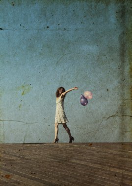 Young girl walks and waves the balloons clipart