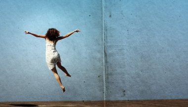 Funny jump of young woman. freedom.