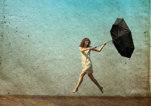 Meisje met paraplu. foto in oude kleur beeld stijl. — Stockfoto