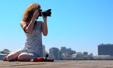 Young girl with a camera clipart