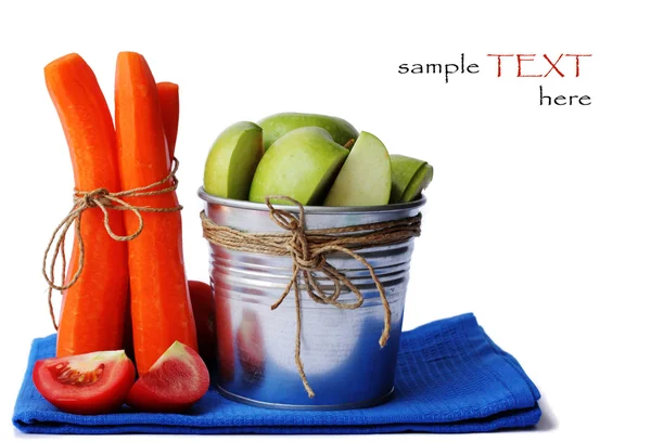 Metal green bucket with green apples carrots — Stock Photo, Image