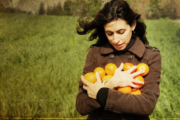 Dívka s pomeranči — Stock fotografie