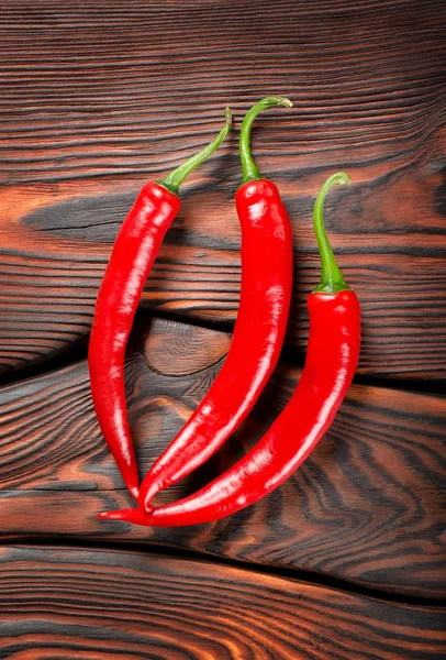 Drie rode chili pepers — Stockfoto