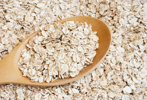 Oats seed in spoon — Stock Photo, Image