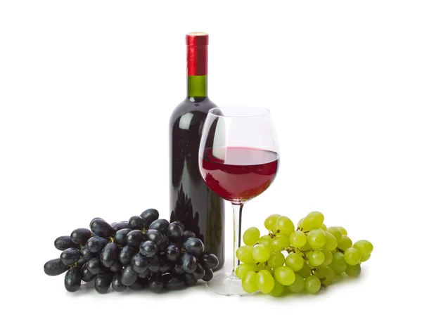 Glas rött vin med flaska och druvor — Stockfoto