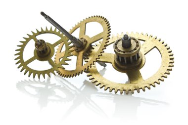 Gears from old clock isolated on white background clipart