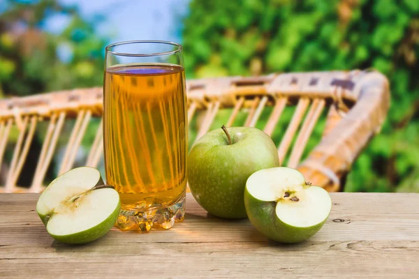 stock image Apple juice in a glass on a table