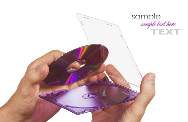 CD-ROM kutusunun içinde el — Stok fotoğraf
