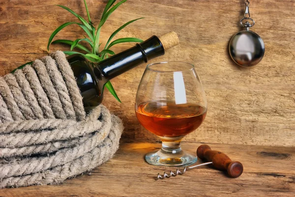 Bottle of wine wrapped with rope — Stock Photo, Image