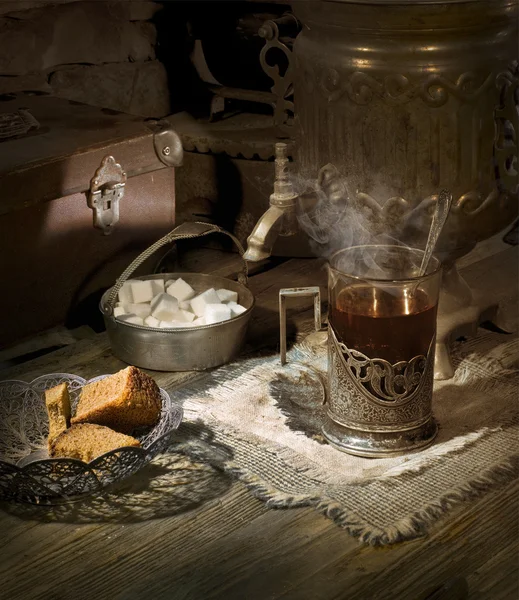 Stock image Old samovar on the table with tea