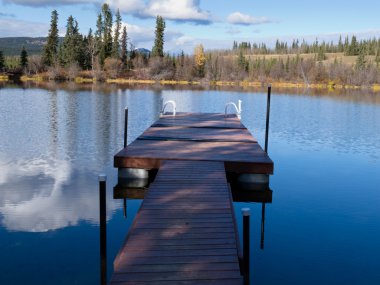 Abandoned floating dock for swimming in lake clipart