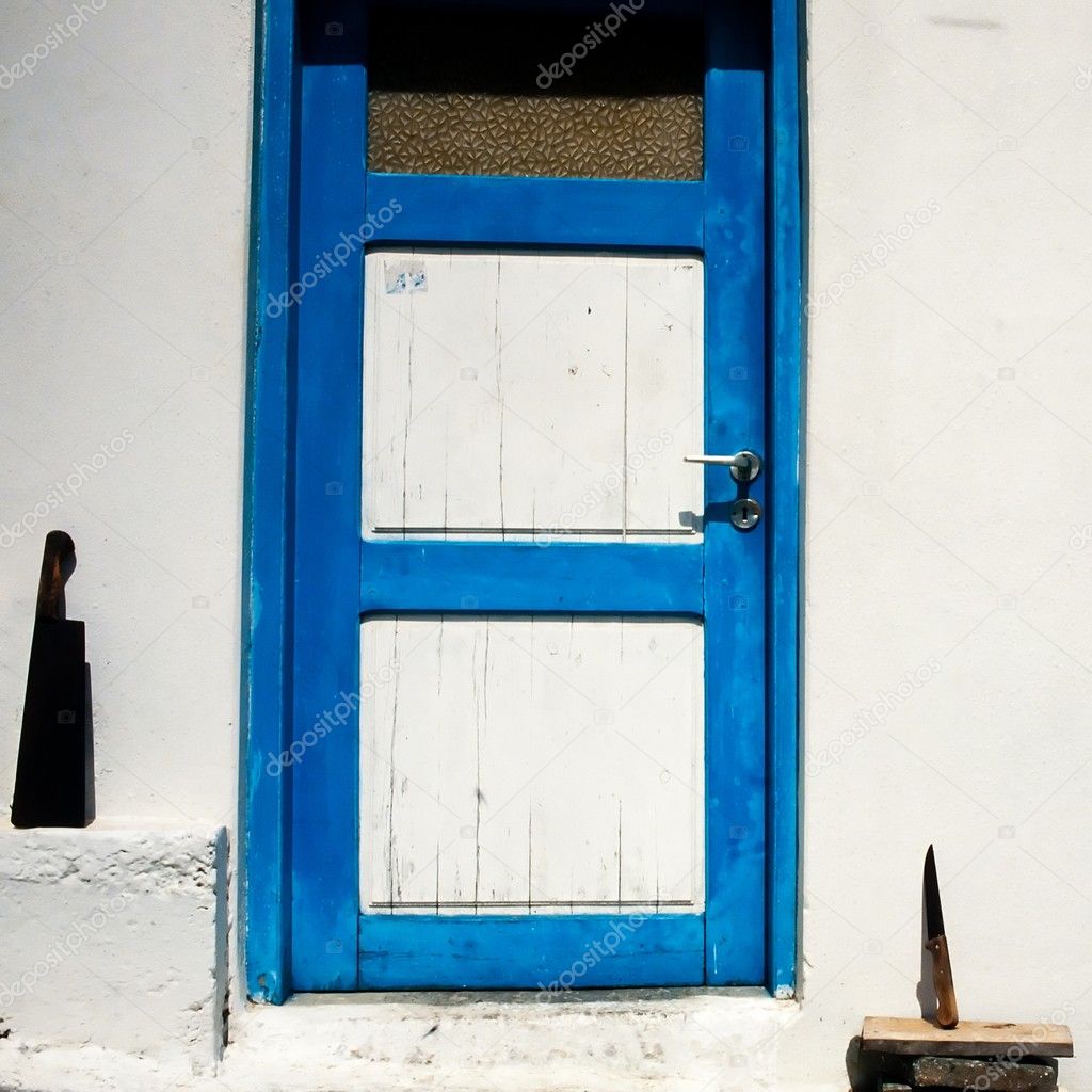Street scene in Greece, door and butcher knifes.