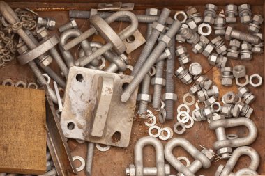 Assorted metal hardware for maintenance work clipart