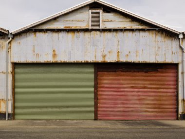 Grungy rusted corrugated iron garage doors clipart