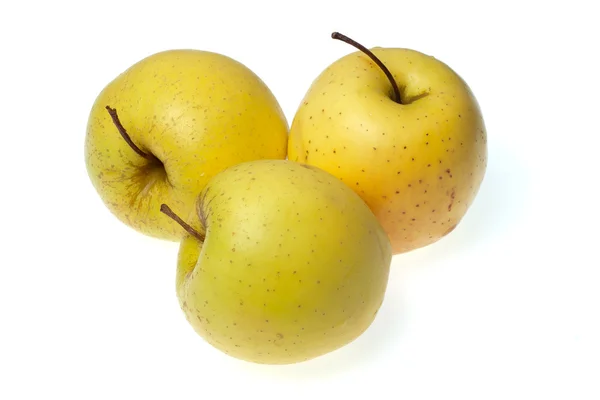 Три желтых яблока — стоковое фото