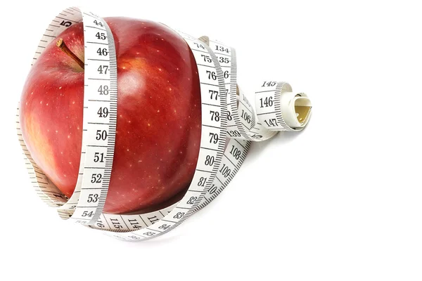 Red apple and measure tape — Stock Photo, Image