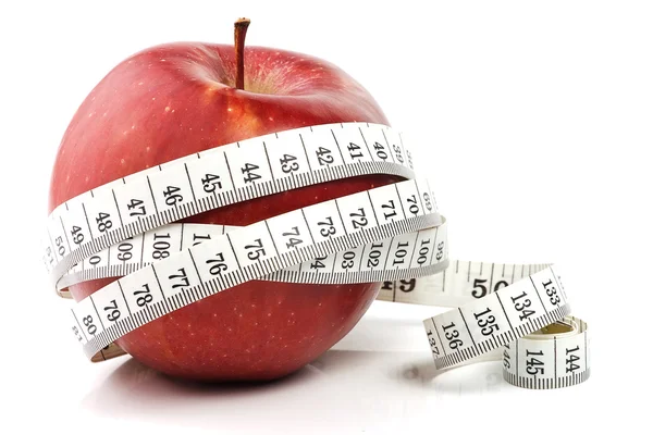 Red apple and measure tape — Stock Photo, Image