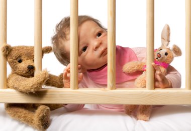 Baby in Cot clipart