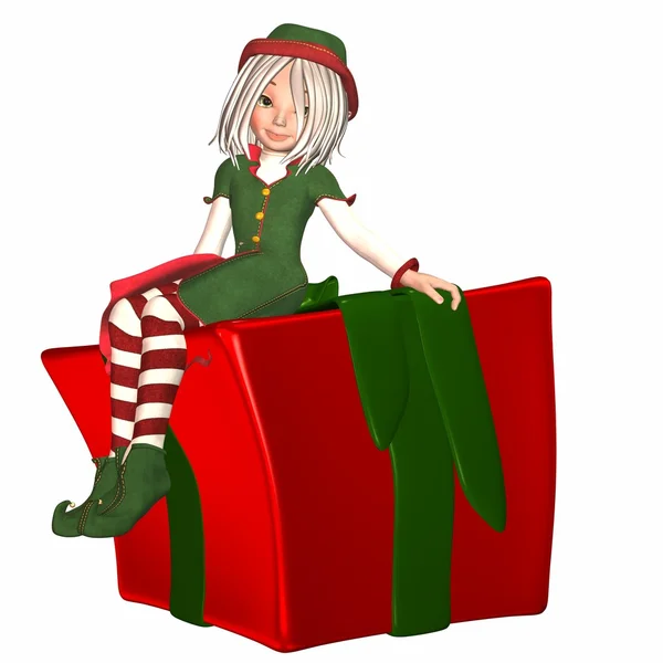 Christmas elf sitter på en present — Stockfoto