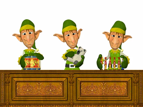 Trzy Boże Narodzenie elfy robiąc zabawki — Zdjęcie stockowe