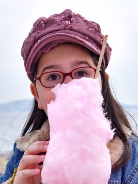 Child eating candy clipart