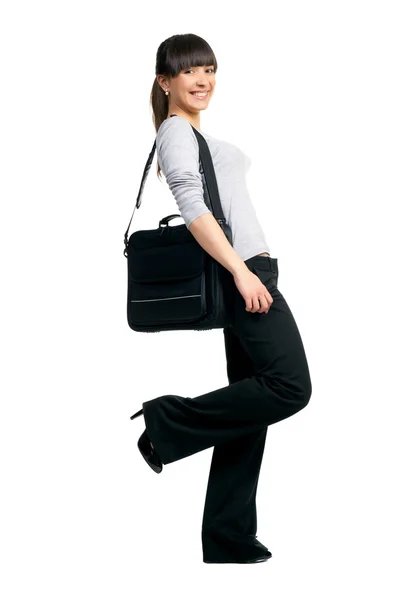 Mooi meisje brunette met zwarte tas — Stockfoto