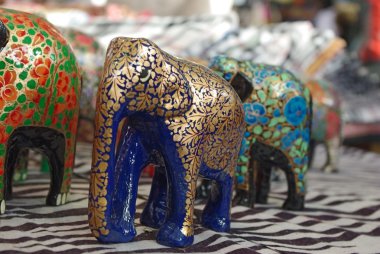 Handcraft wood elephant sculptures clipart