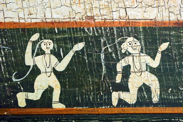 Tanzende Figuren auf altem Hintergrund. — Stockfoto