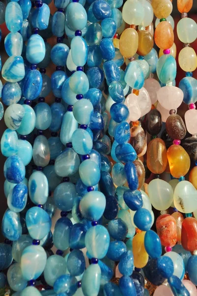 Lot of colored beads from different minerals — Stock Photo, Image