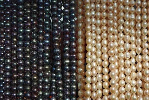 stock image Lot of beads from white and black pearl