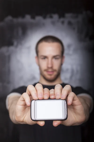 Show me sms message! Man holding mobile phone — Stock Photo, Image