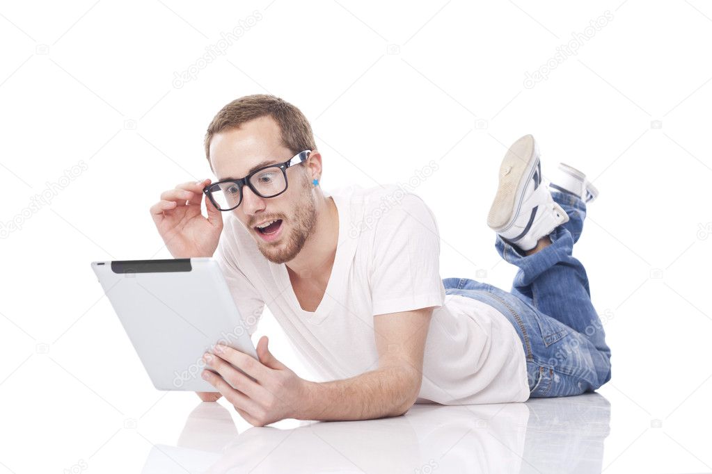 Smart Nerd Man With Tablet Computer lying on the floor