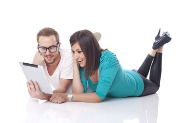 Couple Reading News With Tablet Computer clipart