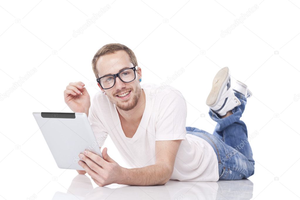 Smart Nerd Man With Tablet Computer lying on the floor