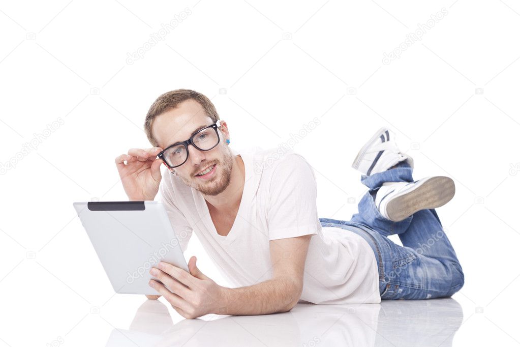 Man Reading News On Tablet Computer