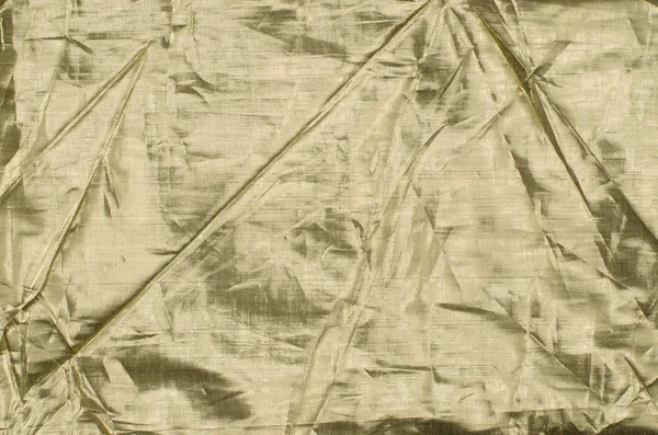 Фон из золотой ткани — стоковое фото