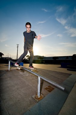 Skateboarder on a slide clipart