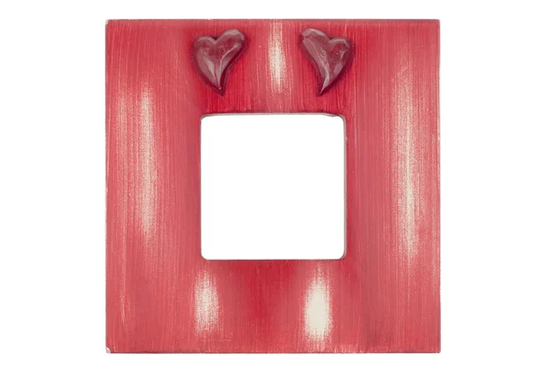 Червона дерев'яна рамка з сердечками — стокове фото