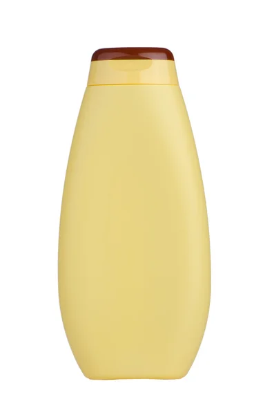 Желтая бутылка шампуня — стоковое фото