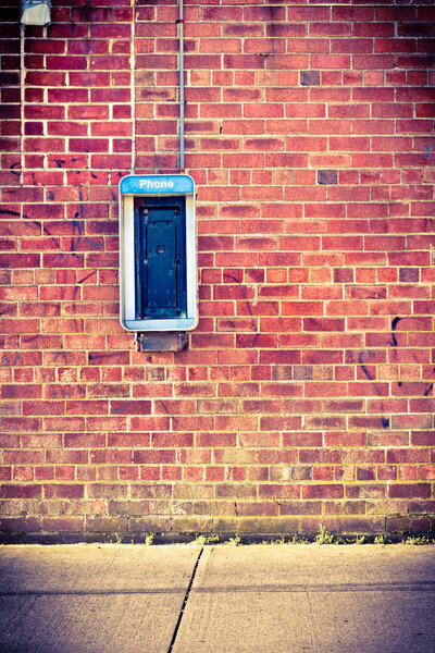 Brick wall with payphone